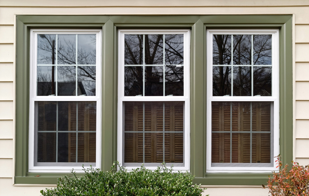 Three,New,Replacement,Windows,With,Green,Trim,On,Front,Of